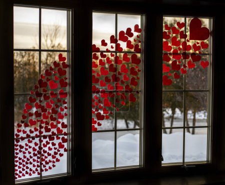 Photo for Love hearts in window with snow outside - Royalty Free Image