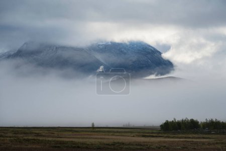 Photo for Clearing storm clouds over mountain Ahkka - Akka from Padjelantaleden - Padjelanta trail, Lapland, Sweden - Royalty Free Image