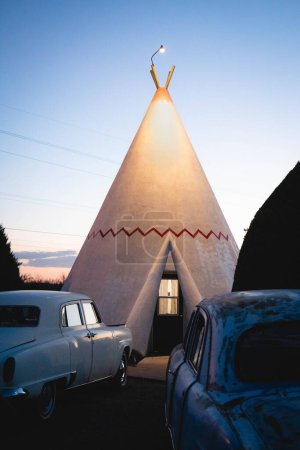 Photo for Rusty Classic cars parked in front of teepee at he Wigwam Motel - Royalty Free Image