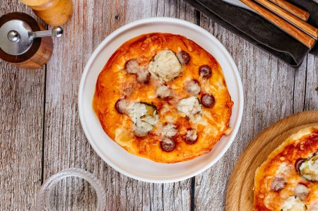 Photo for Homemade pizza with sausages, cheese and vegetables - Royalty Free Image