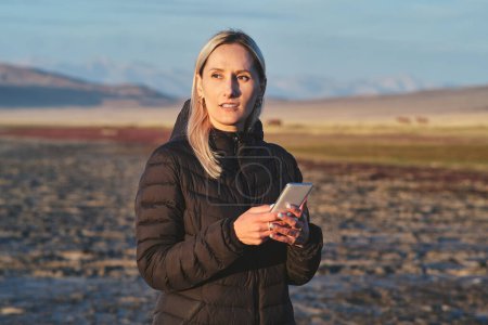 Photo for Portrait of blonde woman, early morning at Tuz Kol Lake - Royalty Free Image