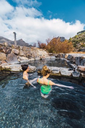 Photo for Two people relaxing in natural hot springs - Royalty Free Image