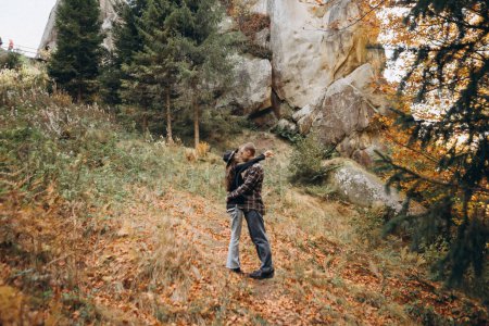Photo for Man and a woman hug on the background of mountains - Royalty Free Image
