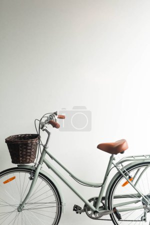 Photo for Vintage bicycle green with basket on white background - Royalty Free Image