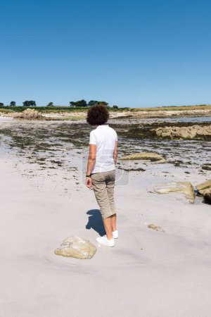 Photo for Full length portrait of middle-aged woman standing on the beach - Royalty Free Image