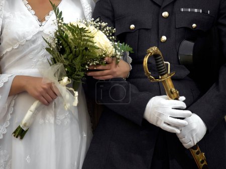 Photo for Detail of a military wedding showing an officer and his bride - Royalty Free Image