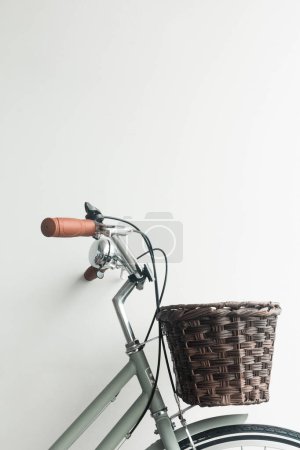 Photo for Vintage bicycle green  with brown basket on white background - Royalty Free Image