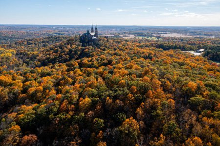Photo for Trees turn beautiful colors in fall near Hubertus, Wisconsin. Located on 435 acres of glorious scenery on the highest elevation in Southeastern Wisconsin, Holy Hill is a destination for those looking to celebrate their faith in a sacred place of peac - Royalty Free Image