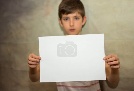 Photo for A child holding a black space for marketing designers, copy space - Royalty Free Image