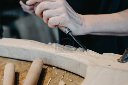 Photo for Photographs of a woman engaged in hand-carving - Royalty Free Image