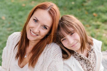 Photo for Close-up of a Caucasian woman with red hair and a teenage daughter - Royalty Free Image