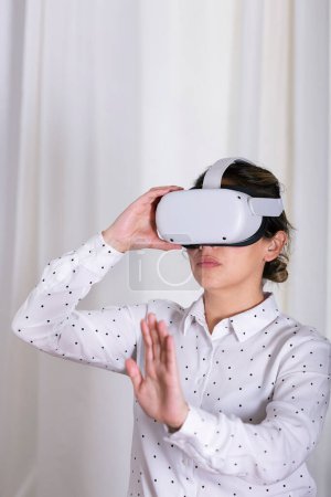 Photo for Businesswoman interacting with VR glasses. - Royalty Free Image
