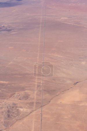 Photo for Aerial view of a desert road and land parcels - Royalty Free Image