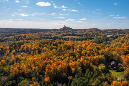 Photo for Trees turn beautiful colors in fall near Hubertus, Wisconsin. Located on 435 acres of glorious scenery on the highest elevation in Southeastern Wisconsin, Holy Hill is a destination for those looking to celebrate their faith in a sacred place of peac - Royalty Free Image