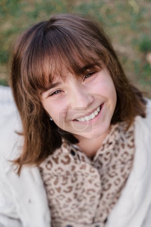 Photo for Vertical portrait of a smiling Caucasian teenage girl 12 years old - Royalty Free Image
