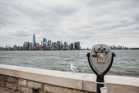 Photo for Coin-operated binoculars facing the New York City skyline and harbor. - Royalty Free Image