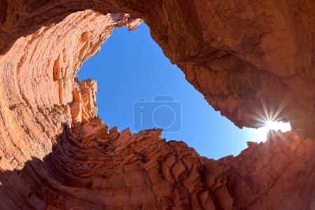 Photo for A natural skylight at the end of a box canyon in Upper Cathedral Wash below the Vermilion Cliffs in Glen Canyon Recreation Area at Marble Canyon Arizona. - Royalty Free Image