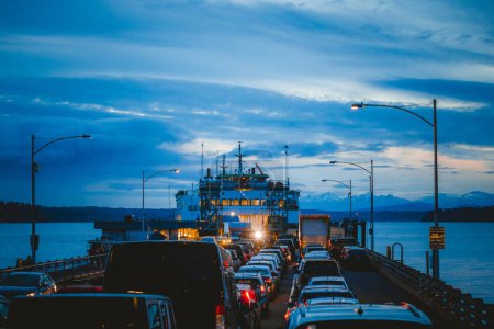 Photo for An evening ferry is full of cars, Puget Sound, WA - Royalty Free Image