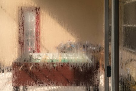 Photo for Air conditioning causes condensation to form on sliding glass door - Royalty Free Image