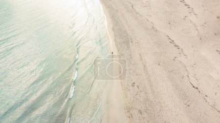 Foto de Aerial view from drone of a natural paradise beach in the mediterranean, with crystal clear water and white sand. sa Coma Mallorca, Balearic Islands - Imagen libre de derechos