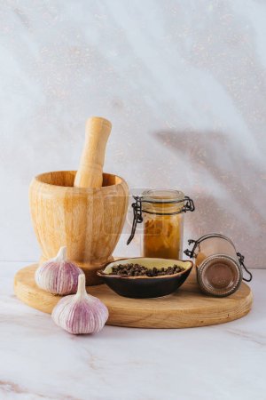Photo for Wooden mortar and black pepper - Royalty Free Image