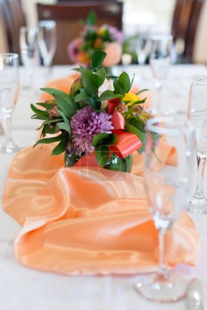 Photo for Floral Centerpiece on formal dining table - Royalty Free Image