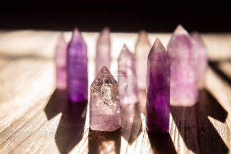Pointed purple Caribbean calcite standing up with sun shining through
