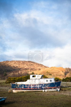 Photo for An abandoned scuttled boat in Scottish highlands - Royalty Free Image