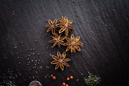 Photo for Star Anise and spices on a chopping board - Royalty Free Image