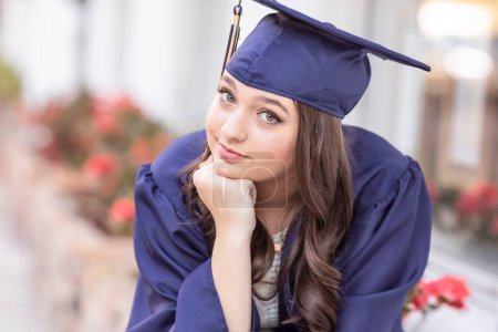 Photo for Close up of girl in blue cap and gown - Royalty Free Image