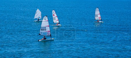 Photo for Four Sailboats on Blue - Royalty Free Image