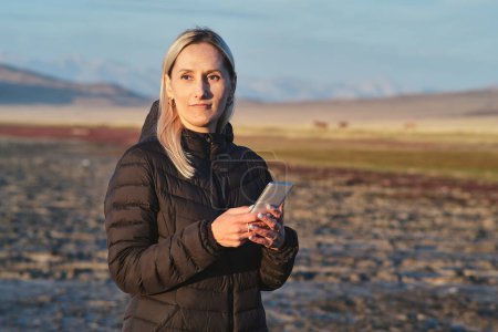 Photo for Portrait of blonde woman, early morning at Tuz Kol Lake - Royalty Free Image