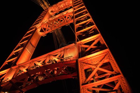 Photo for Illuminated suspension bridge of the city of Santa Fe, Argentina. - Royalty Free Image