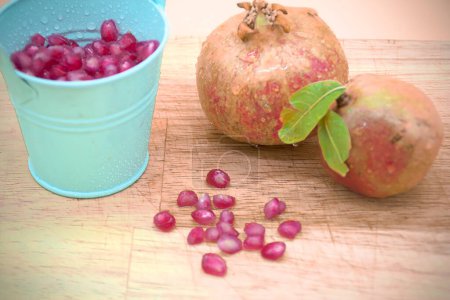 Photo for Macro photography decomposition of turquoise bucket with pomegranate f - Royalty Free Image