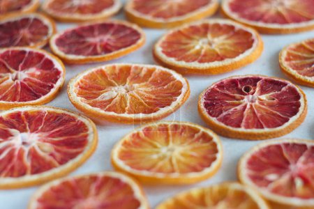 Photo for Dried orange slices lie on a table. - Royalty Free Image