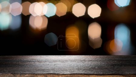 Photo for Empty wooden table for present product on coffee shop or soft drink bar blur background with bokeh image - Royalty Free Image