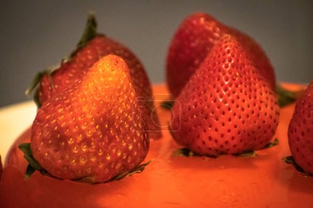 Photo for Strawberries under the saturated red light - Royalty Free Image