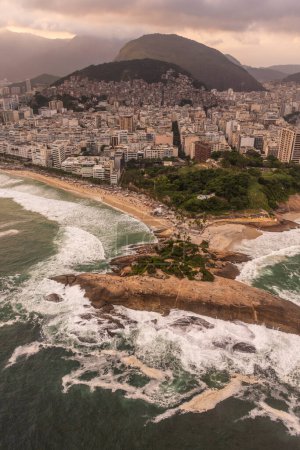 Photo for Beautiful aerial view to ocean rocky point in Arpoador and city buildings in Ipanema, Rio de Janeiro, Brazil - Royalty Free Image