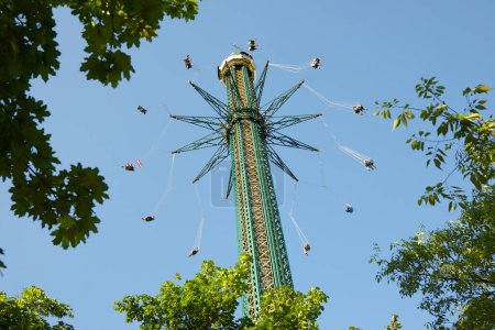 Photo for Vienna, Austria - June 21, 2019: tourists enjoying the attraction known as Chairoplane Prater Tower - Royalty Free Image