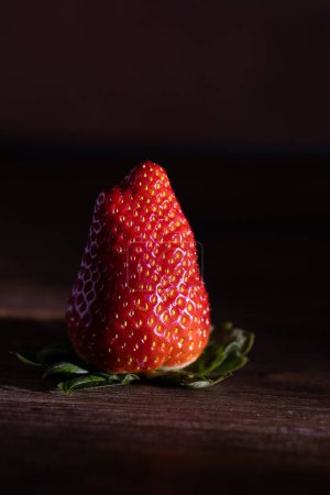 Photo for Large strawberries on a wooden table. Close-up - Royalty Free Image