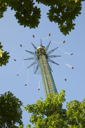 Photo for Vienna, Austria - June 21, 2019: tourists enjoying the attraction known as Chairoplane Prater Tower - Royalty Free Image