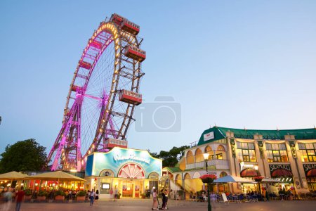 Photo for Vienna, Austria - June 25, 2019: Tourists visiting Ferris wheel of Vienna Prater Park. Place where scenes from the movie The Third Man were filmed. - Royalty Free Image