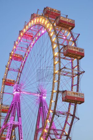 Photo for Vienna, Austria - June 25, 2019: Tourists visiting Ferris wheel of Vienna Prater Park. Place where scenes from the movie The Third Man were filmed. - Royalty Free Image