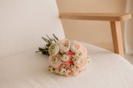 Pink and White Bouquet on a White Armchair
