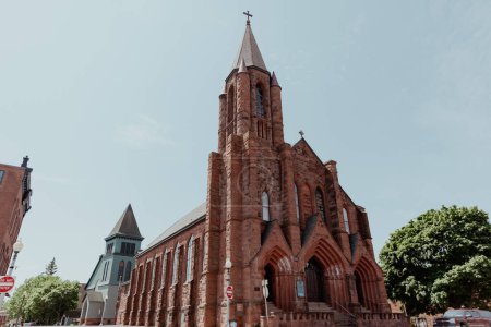 Photo for Red sandstone church against bright blue sky - Royalty Free Image