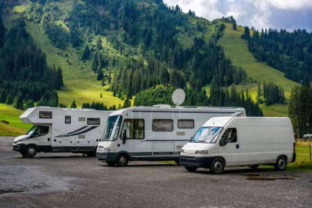 Photo for Camper van and motorhomes parked on a mountain landscape - Royalty Free Image