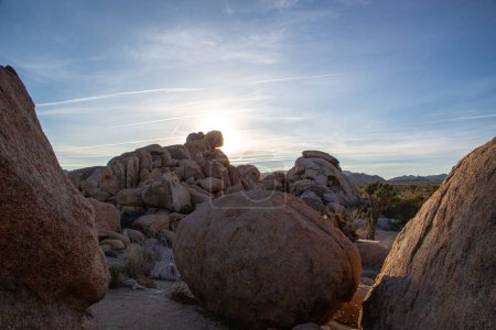 Photo for Sunburst through desert rocks at sunrise - Royalty Free Image