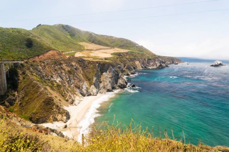 Bixby Bridge with stunning coastal cliffs and turquoise waters!