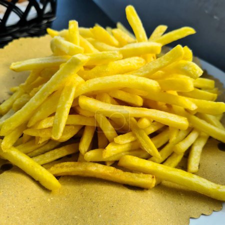 evocative close-up image of french fries in a fast food restaurant