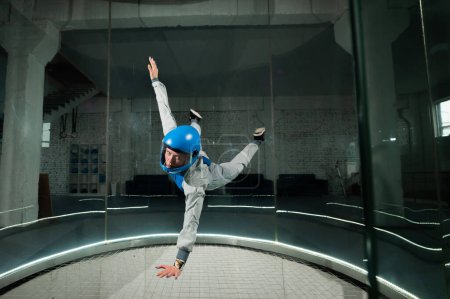A woman flies in a wind tunnel. Free fall simulator